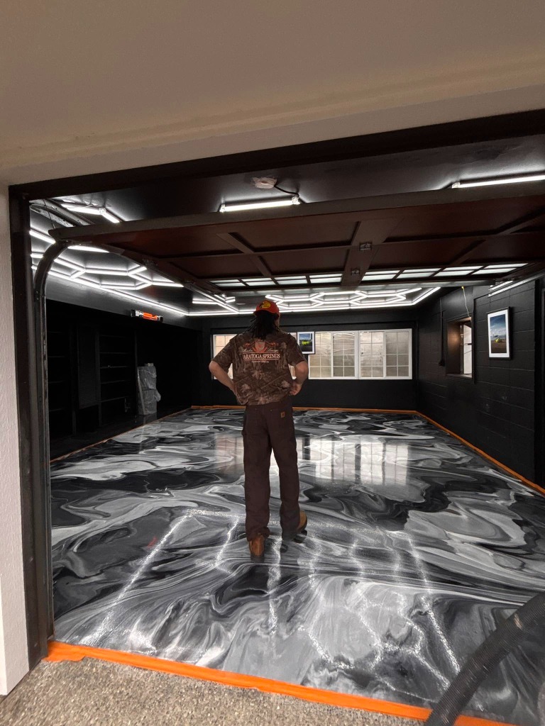 Showcase Metallic Marble Garage with Honeycomb Ceiling Lights by GR8 Paints & Epoxies
